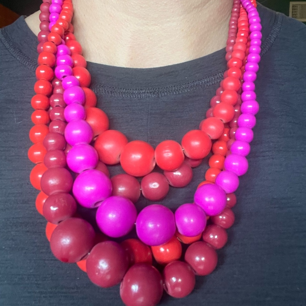 Multi string reds and pink beaded necklace